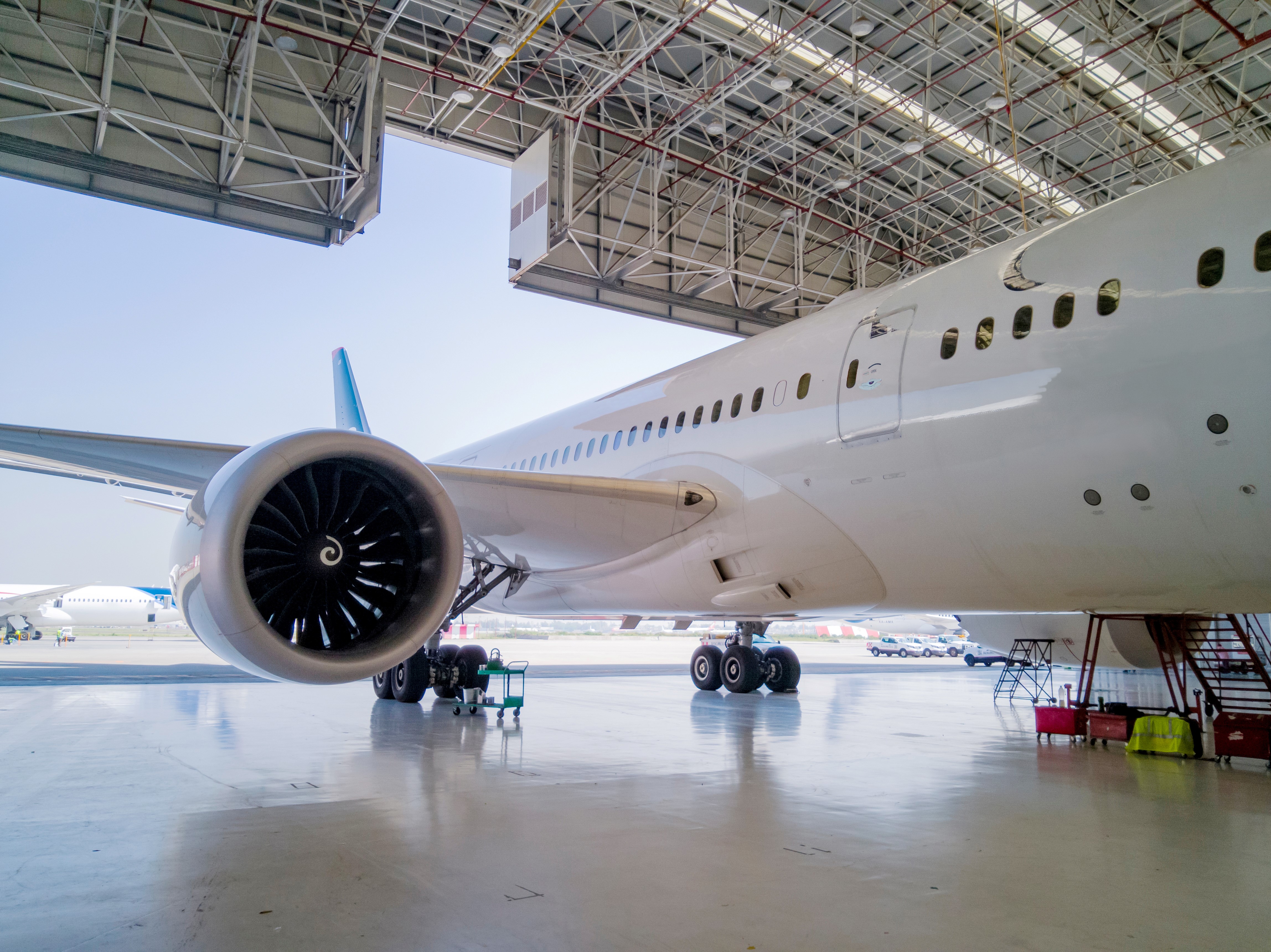 A commercial airliner sits in a hangar. Jet Centre by Willis offers a full range of airport FBO and ground handling services.
