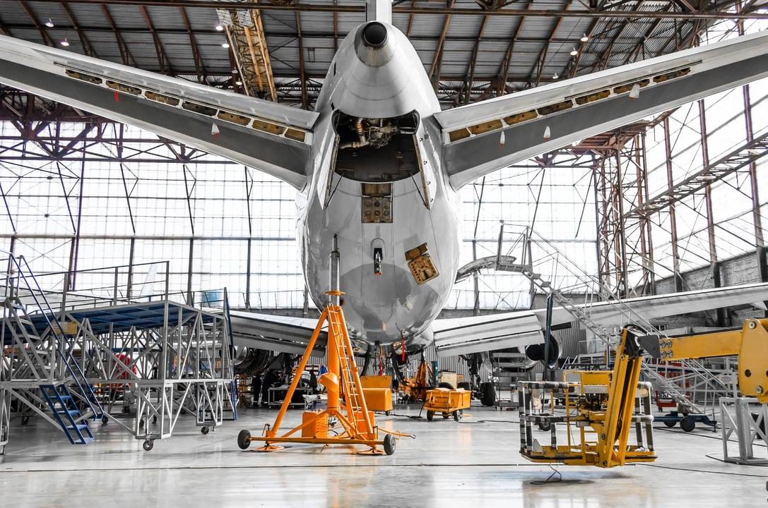 An Airbus A320 surrounded by wing, engine, and jack stands. Willis has all the necessary facilities to maintain your aircraft