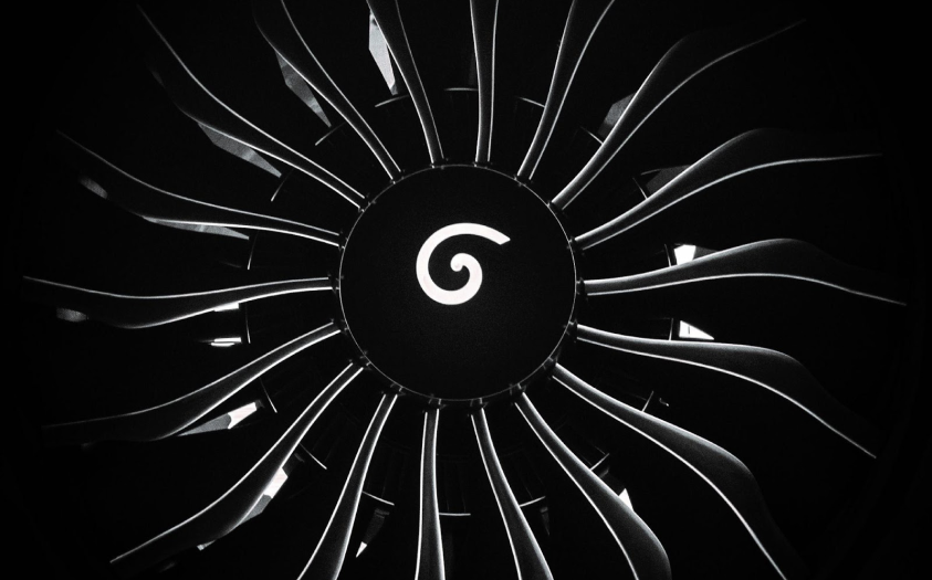 The front view of an industrial gas turbine engine reveals the forward fan blades. Industrial gas turbines generate power.